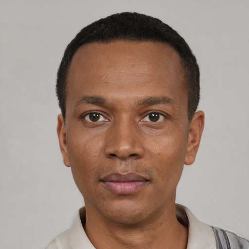 Neutral latino adult male with short  black hair and brown eyes