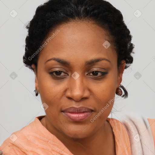 Joyful black adult female with short  brown hair and brown eyes