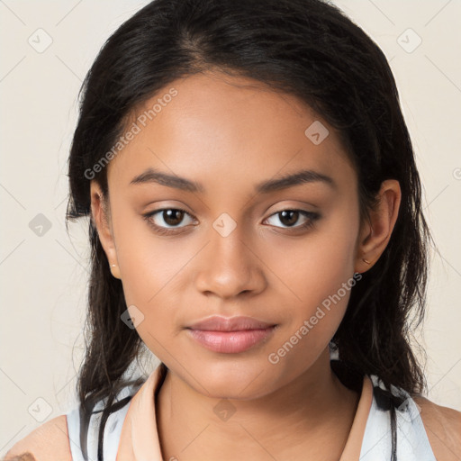 Joyful latino young-adult female with long  brown hair and brown eyes