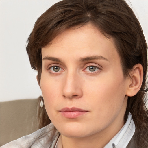 Neutral white young-adult female with medium  brown hair and grey eyes