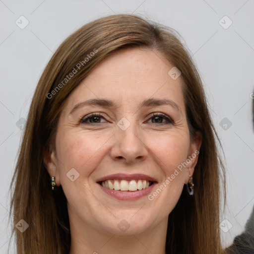 Joyful white adult female with long  brown hair and grey eyes