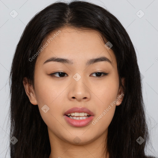 Joyful asian young-adult female with long  brown hair and brown eyes