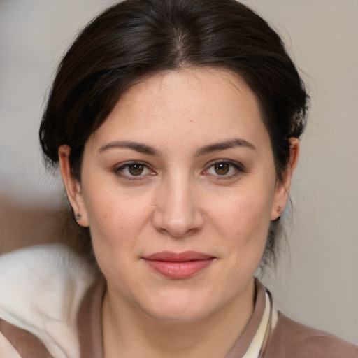 Joyful white young-adult female with medium  brown hair and brown eyes