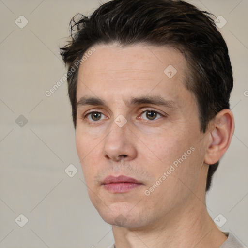 Neutral white adult male with short  black hair and brown eyes