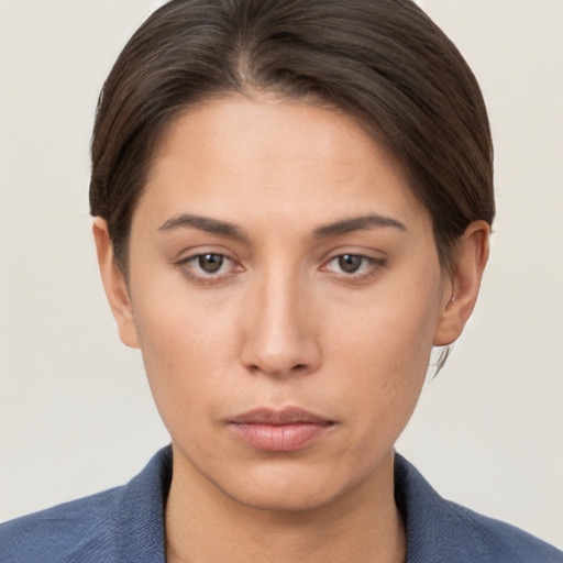 Neutral white young-adult female with short  brown hair and brown eyes