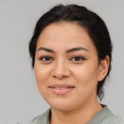 Joyful asian young-adult female with medium  brown hair and brown eyes