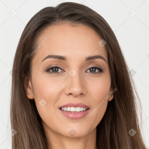 Joyful white young-adult female with long  brown hair and brown eyes