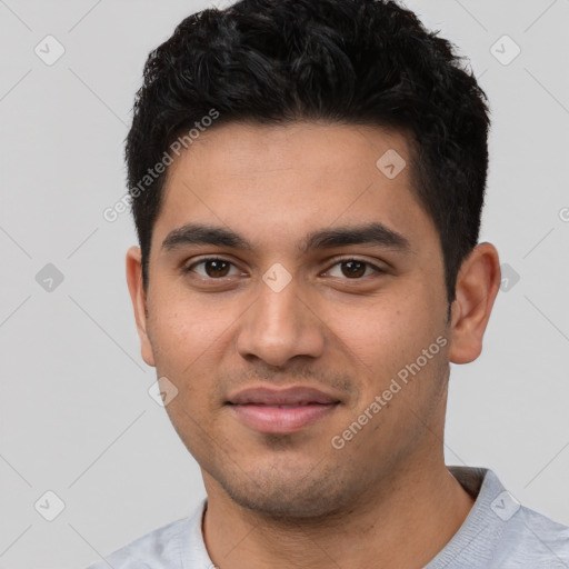 Joyful latino young-adult male with short  black hair and brown eyes