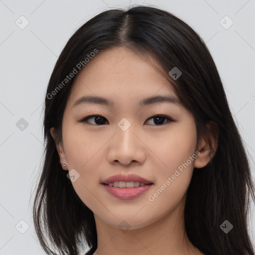 Joyful asian young-adult female with long  black hair and brown eyes