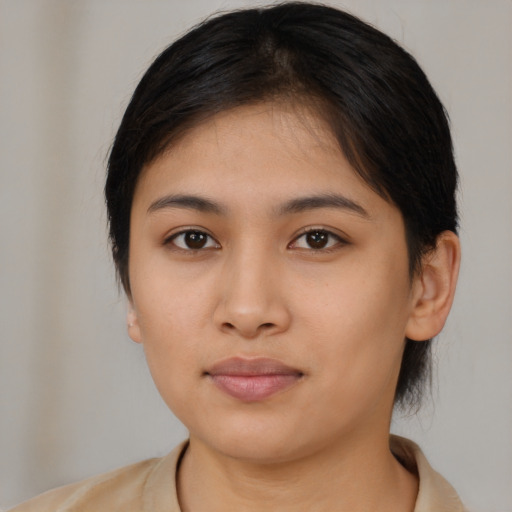 Neutral asian young-adult female with medium  brown hair and brown eyes