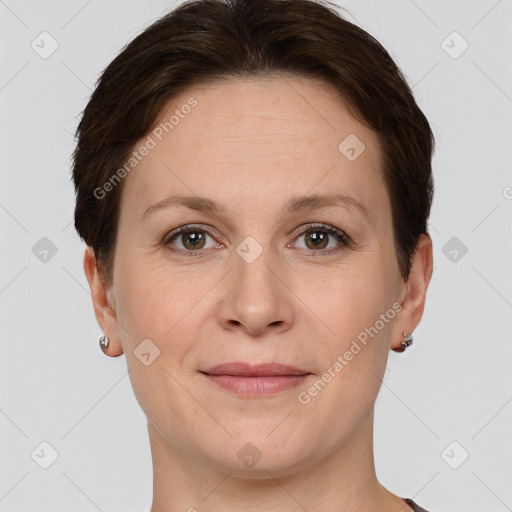 Joyful white young-adult female with short  brown hair and grey eyes