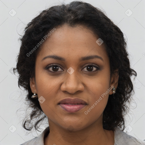 Joyful black young-adult female with long  brown hair and brown eyes