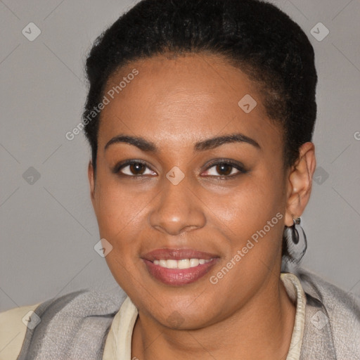 Joyful black young-adult female with short  brown hair and brown eyes