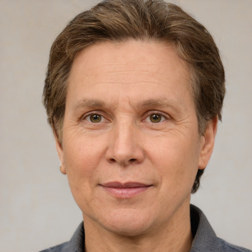 Joyful white adult male with short  brown hair and grey eyes