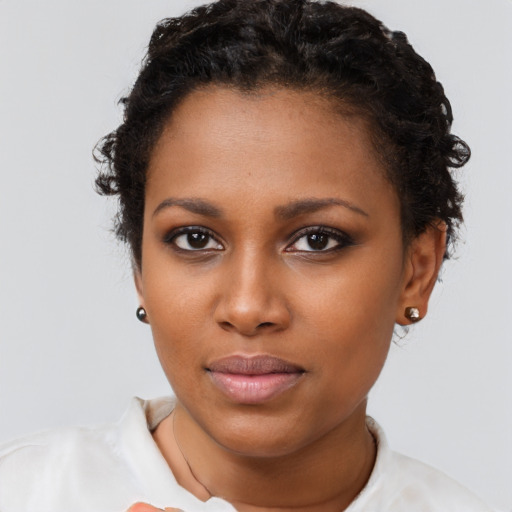 Neutral black young-adult female with short  brown hair and brown eyes