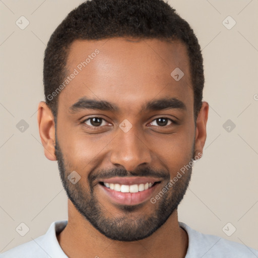 Joyful black young-adult male with short  brown hair and brown eyes