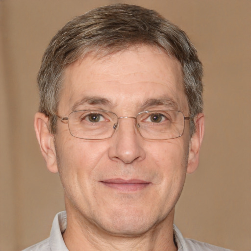 Joyful white middle-aged male with short  brown hair and brown eyes