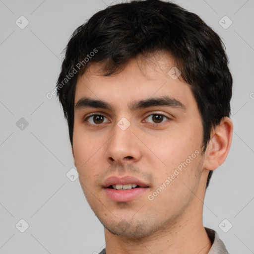 Neutral white young-adult male with short  black hair and brown eyes