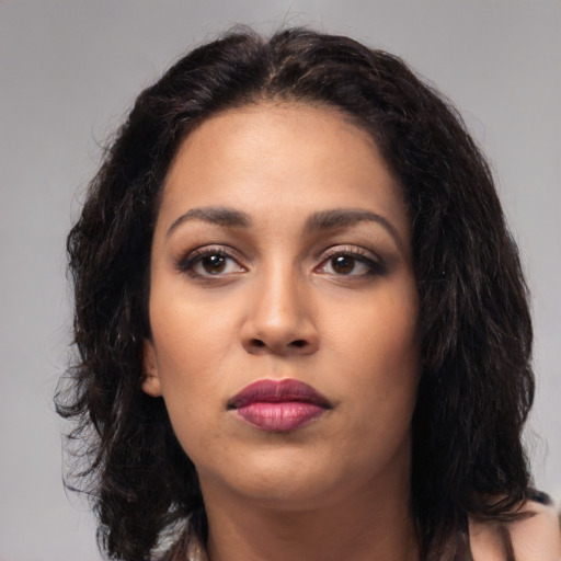 Neutral latino young-adult female with long  black hair and brown eyes