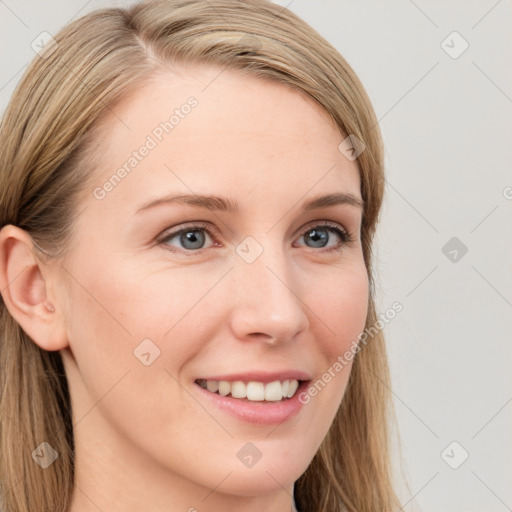 Joyful white young-adult female with long  brown hair and blue eyes