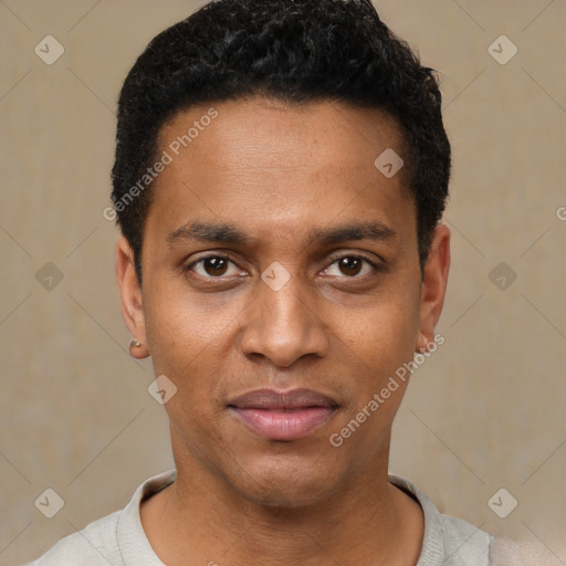 Joyful black young-adult male with short  black hair and brown eyes