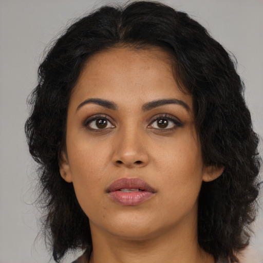 Neutral latino young-adult female with medium  brown hair and brown eyes