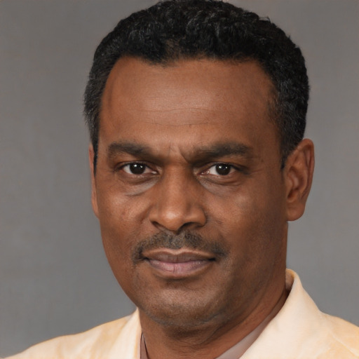 Neutral black adult male with short  black hair and brown eyes