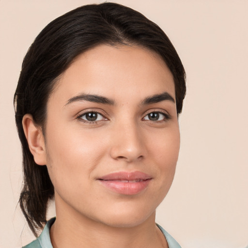 Joyful white young-adult female with medium  brown hair and brown eyes