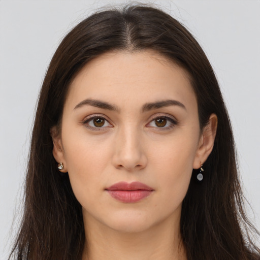 Neutral white young-adult female with long  brown hair and brown eyes