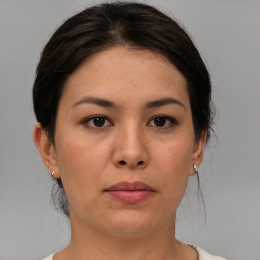 Joyful asian young-adult female with medium  brown hair and brown eyes