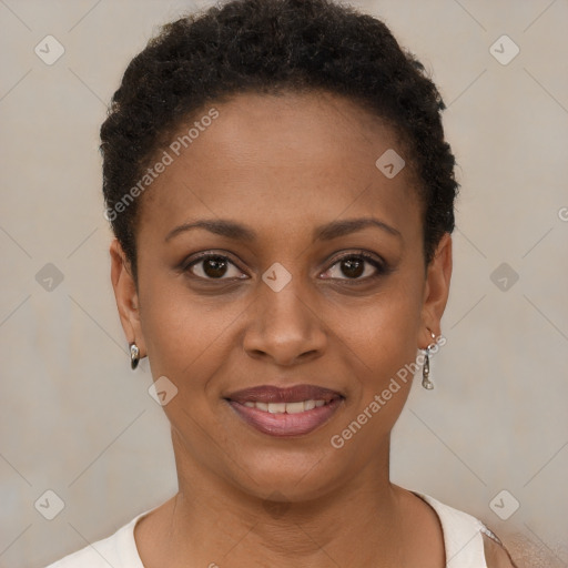 Joyful black young-adult female with short  brown hair and brown eyes