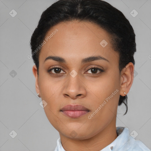 Joyful latino young-adult female with short  brown hair and brown eyes