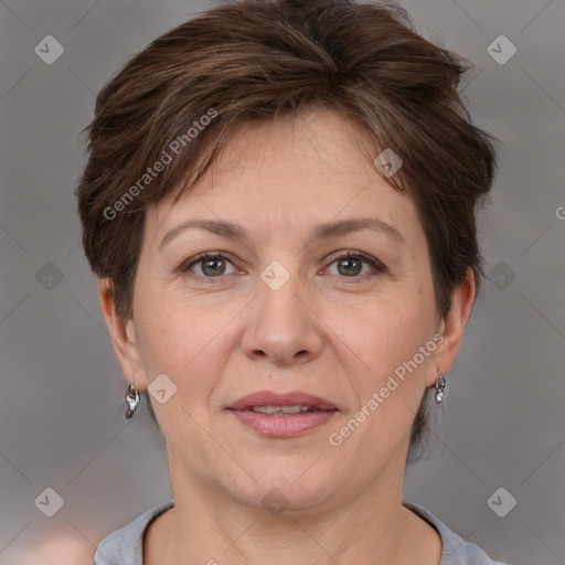 Joyful white adult female with short  brown hair and brown eyes