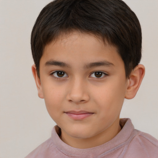 Joyful white child male with short  brown hair and brown eyes