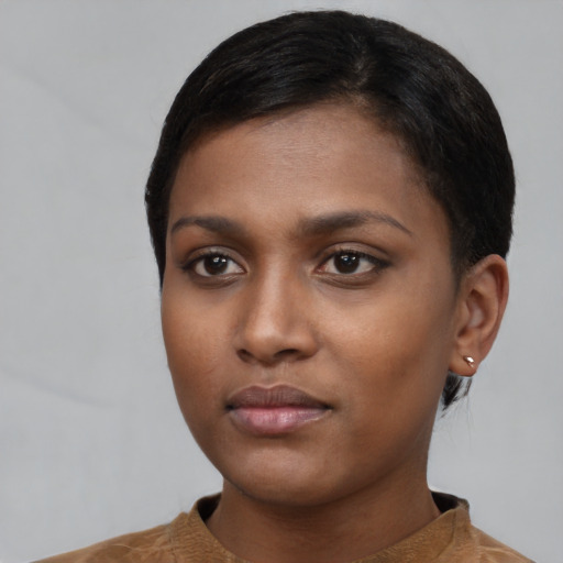 Neutral black young-adult female with short  black hair and brown eyes