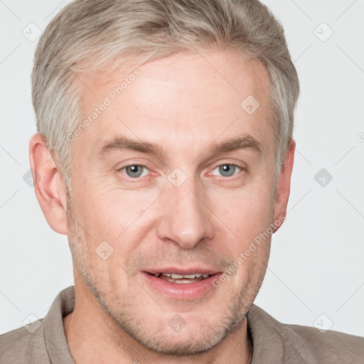 Joyful white adult male with short  brown hair and grey eyes