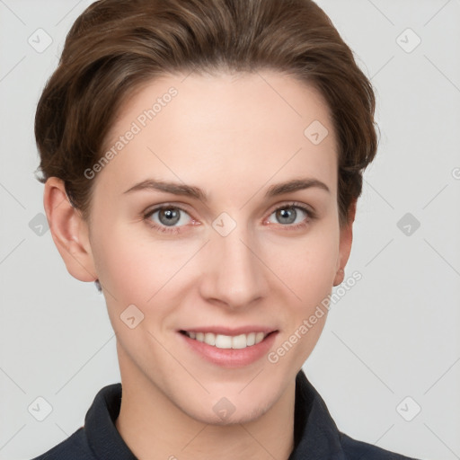 Joyful white young-adult female with short  brown hair and grey eyes