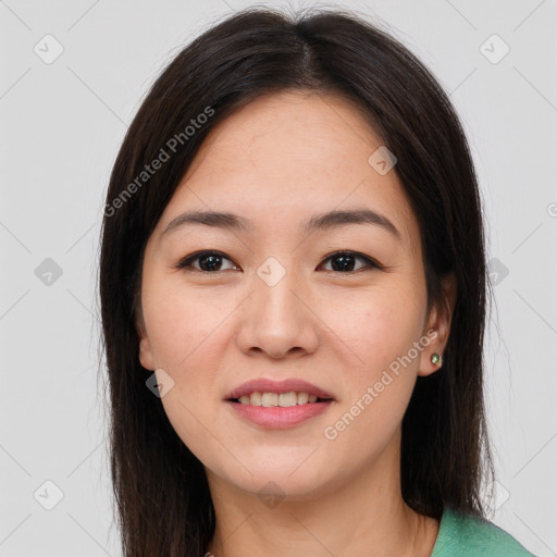 Joyful asian young-adult female with long  brown hair and brown eyes