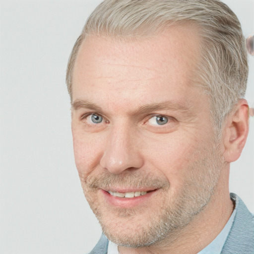 Joyful white adult male with short  brown hair and grey eyes