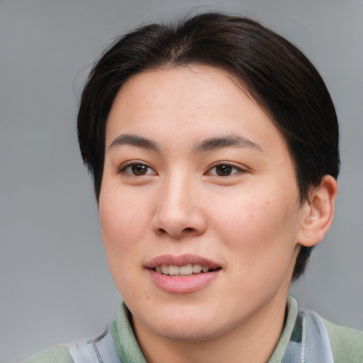 Joyful asian young-adult female with medium  brown hair and brown eyes