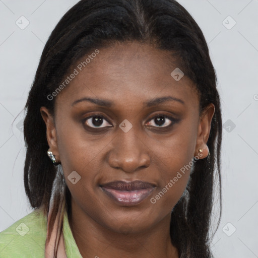 Joyful black young-adult female with long  brown hair and brown eyes