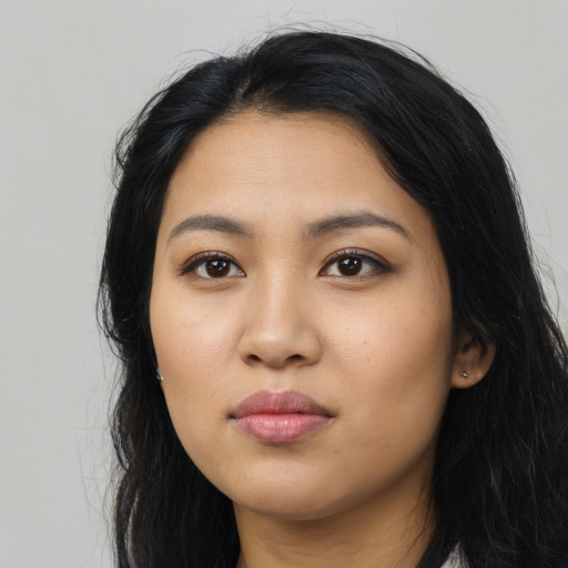 Neutral latino young-adult female with long  black hair and brown eyes