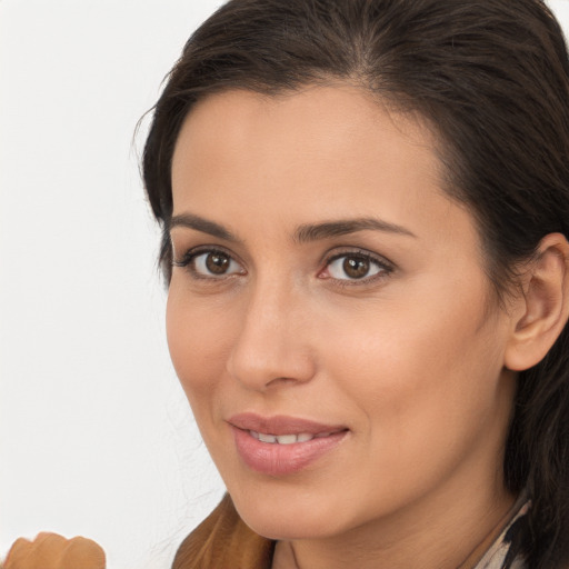 Joyful white young-adult female with long  brown hair and brown eyes