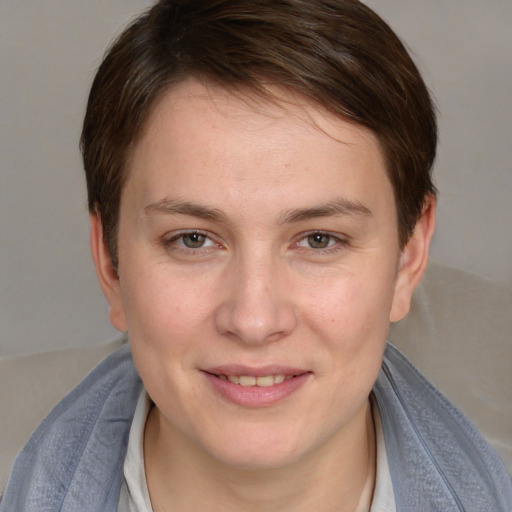 Joyful white young-adult female with medium  brown hair and blue eyes