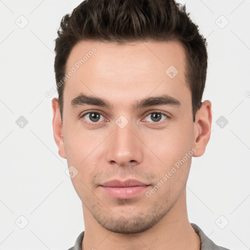 Neutral white young-adult male with short  brown hair and brown eyes