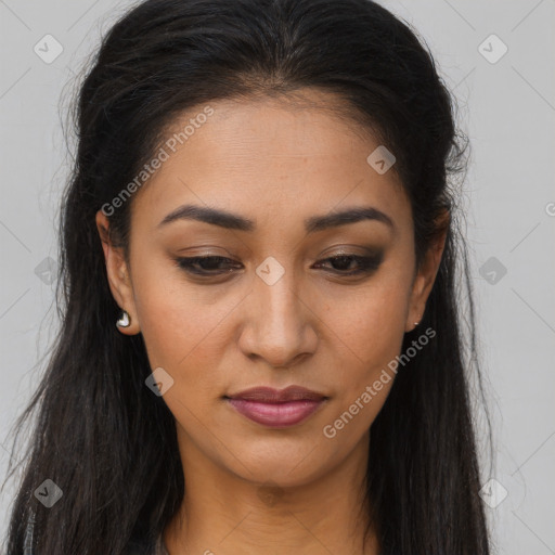 Joyful latino young-adult female with long  brown hair and brown eyes