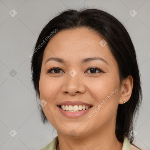 Joyful asian young-adult female with medium  brown hair and brown eyes