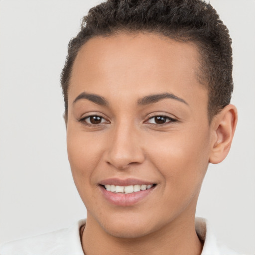 Joyful white young-adult female with short  brown hair and brown eyes