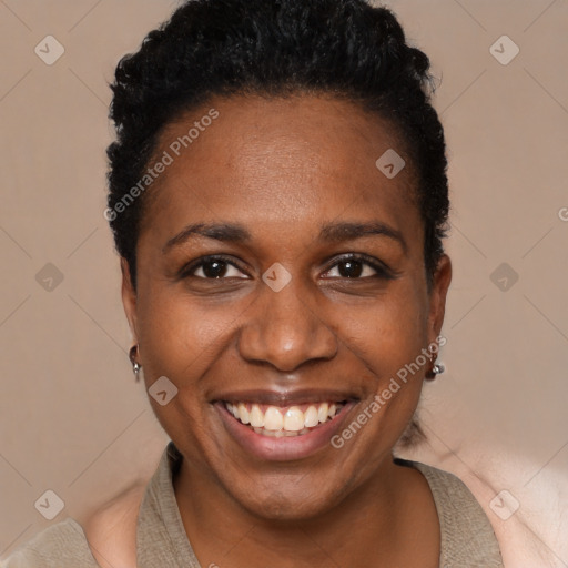 Joyful black young-adult female with short  black hair and brown eyes