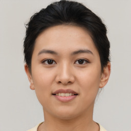Joyful asian young-adult female with short  brown hair and brown eyes